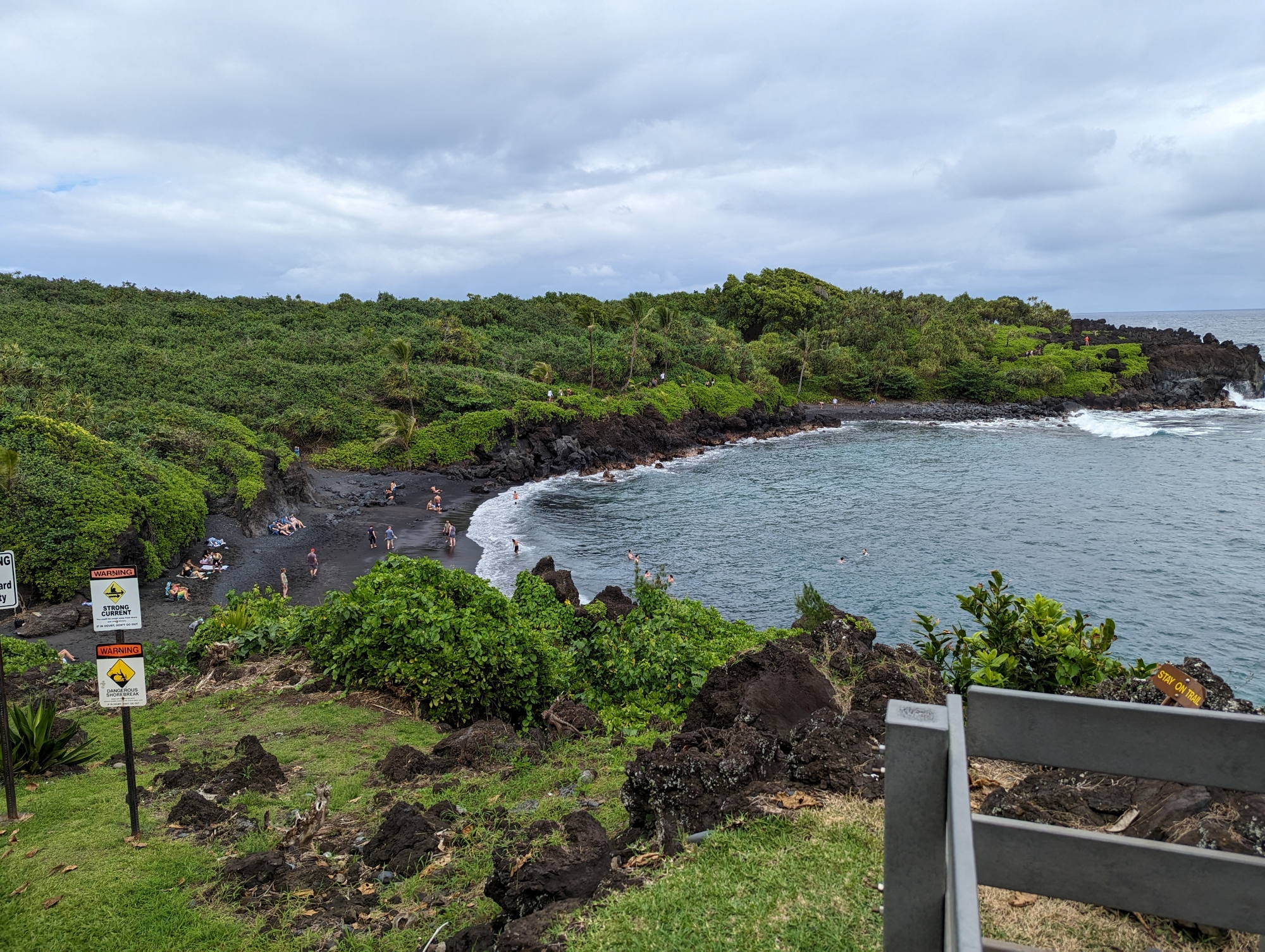 A picture of a volcanic black-sand beach on the east shore of Maui.